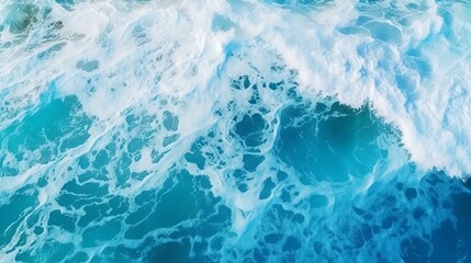 Obraz premium From above aerial view of turquoise ocean water with splashes and foam for abstract natural background and texture