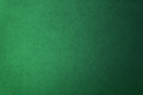 Deep dark green tone color paint on environmental friendly cardboard box blank paper texture background with space minimal style