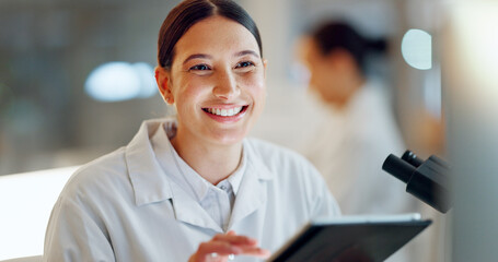 Scientist, woman and tablet, microscope or laboratory research for DNA analysis and happy with...