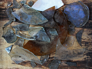 Top view of fragment of plates and bowls on the wooden board. 