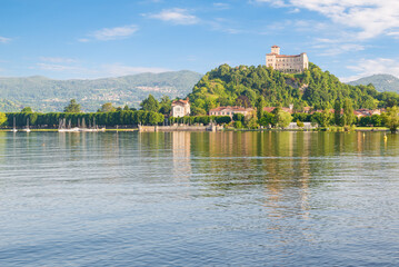 Lake Maggiore with the city of Angera and the castle or Rocca of Angera (fortress of Angera) on the...