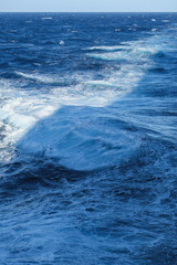 Seascape ocean view from cruiseship cruise ship liner making waves plowing through the sea cruising