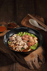 Chinese beef noodle soup. Taiwanese beef noodle on wooden background.
