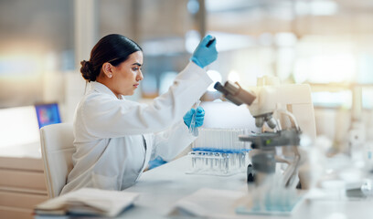 Science, laboratory and woman with pipette, test tube and biotech solution in research. Medical...