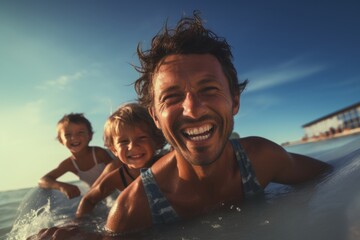 Joyful family playing in the sea