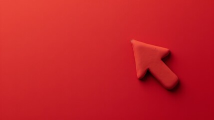 Arrow made of plasticine on red background. Direction symbol
