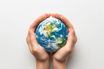 Miniature planet Earth in hand against a background of grass sky and sun