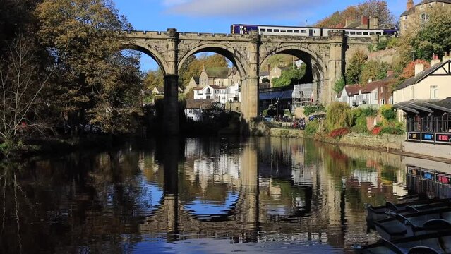 Train departing Knaresborough Station over the river Nidd Viaduct