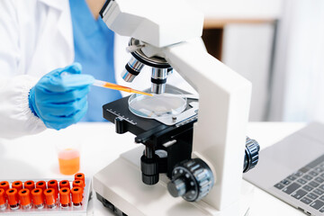 female scientist working with micro pipettes analyzing biochemical samples, advanced science...