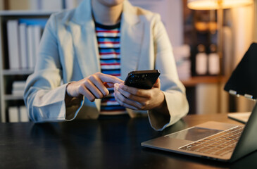 Businesswoman s hands typing on smartphone, tablet and laptop keyboard computer, typing, online in office