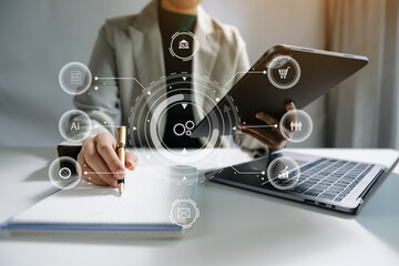 Digital marketing media in virtual screen.businesswoman hand working with mobile phone and modern compute