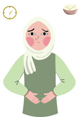 A little Muslim child looks very hungry and can't wait to break his fast