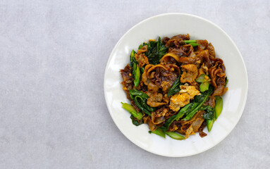 Stir-fried rice noodles with soy sauce and pork