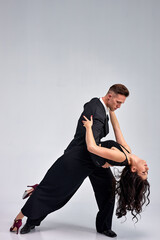 World Dance Sport Federation Dancers On Rehearsal In Studio, Sport Dance. in classic formal wear suit and dance dance with passion. sensual dancers dancing walz, tango, slowfox and quickstep.