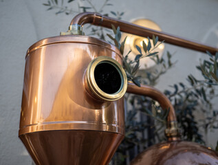 Thermometer at copper distillery still