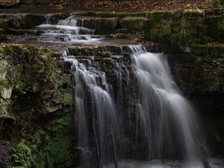 Fototapeta premium The waterfall in green forest.