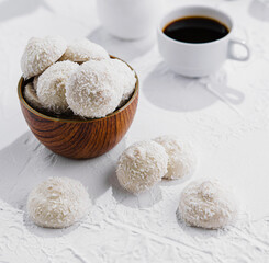 candies in white glaze and coconut flakes