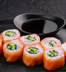 Philadelphia salmon sushi with cucumber inside on plate