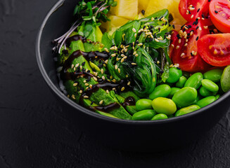 bowl with seaweed, beans, avocado and pineapple