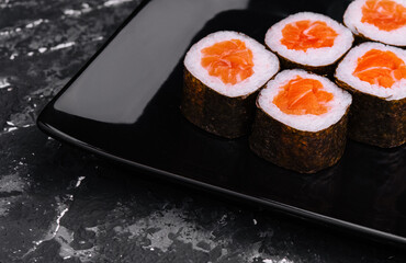 Salmon Maki Sushi on Black Stone Plate