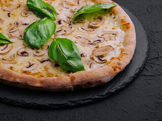 Mushroom pizza with cheese and basil