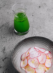 Summer cold soup - okroshka in a ceramic bowl