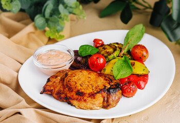 pork ribs with potatoes and pork steak with grilled vegetables