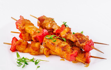 Chicken skewers with slices of sweet peppers