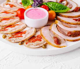 sliced meatloaf with peppers and capers