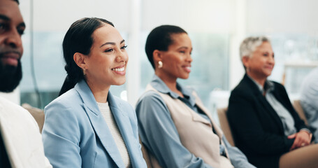 Smile, laughing a business woman in a meeting with her colleagues for training in a workshop or...