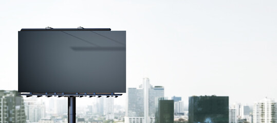 Empty black mock up banner in dull city sky. Commercial concept. 3D Rendering.