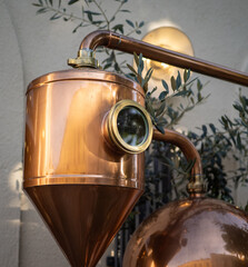 Thermometer at copper distillery still
