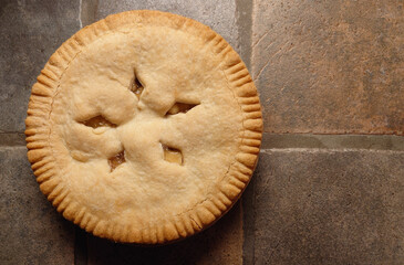 kitchen countertop closeup of purchased apple pie  