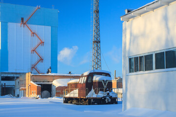 Feed mill, industrial buildings in sunny winter day, nobody.
