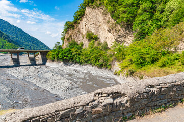 Fototapeta na wymiar Old stone bridge named Ulu Korpu was built in the 18th century near Ilisu village, northwest Azerbaijan