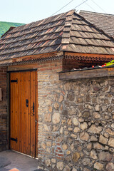 Old wooden door and stone fence
