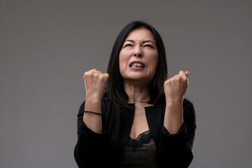 Overcome with frustration, her expression fiercely intense