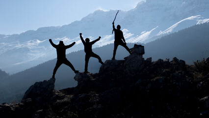 The mountaineer team climbing to the top and the magnificent snowy mountains