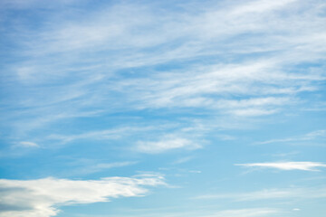 A beautiful sky tinted by the sun leaving vibrant shades of gold, pink, blue and multicolored. Clouds in the twilight evening and morning sky. Cloudy sky background in the evening and during the day.