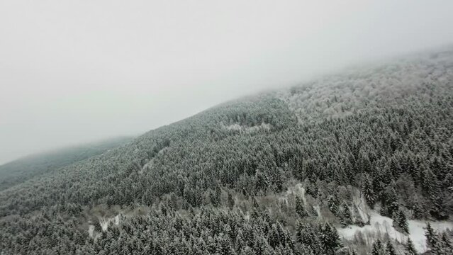 Landscape view from the drone with mountains with snow on Winter in Romania