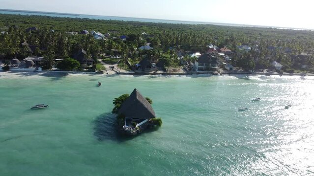 Zanzibar shoreline with house out in the water, tanzania, africa