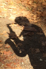 the shadow of a man playing the saxophone