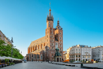 Saint Mary's Basilica on the main market square at sunrise in Cracow, Poland - obrazy, fototapety, plakaty