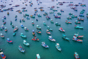 Fototapeta na wymiar View of longest cable car ride in the world, Phu Quoc island, Vietnam, sunset sky. Below is seascape with tropical islands and boats.