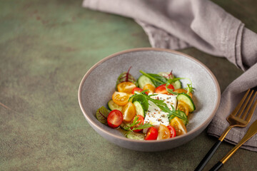 Easy greek salad of fresh cucumber, tomato, arugula,  feta cheese  with olive oil. Healthy food. Copy space
