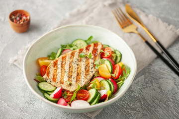 Juicy pork steak grill with vegetables in a plate on the table.