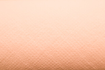 Light gradient paper backdrop, trendy peach fuzz color. Textures formed by cardboard or paper...