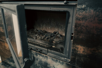 Open fireplace with ashes. Fireplace cleaning. Housework