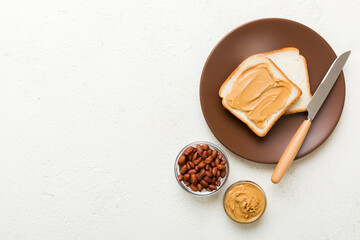 Peanut butter sandwiches or toasts on light table background.Breakfast. Vegetarian food. American cuisine top view vith copy space