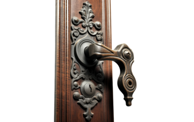 Ornate Door Handle on Wooden Door. A detailed view of an intricately designed door handle mounted on a solid wooden door.